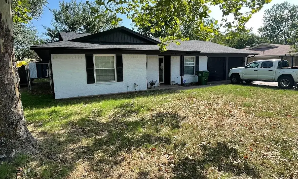 Professional roofing crew working on a residential roof in Paramus